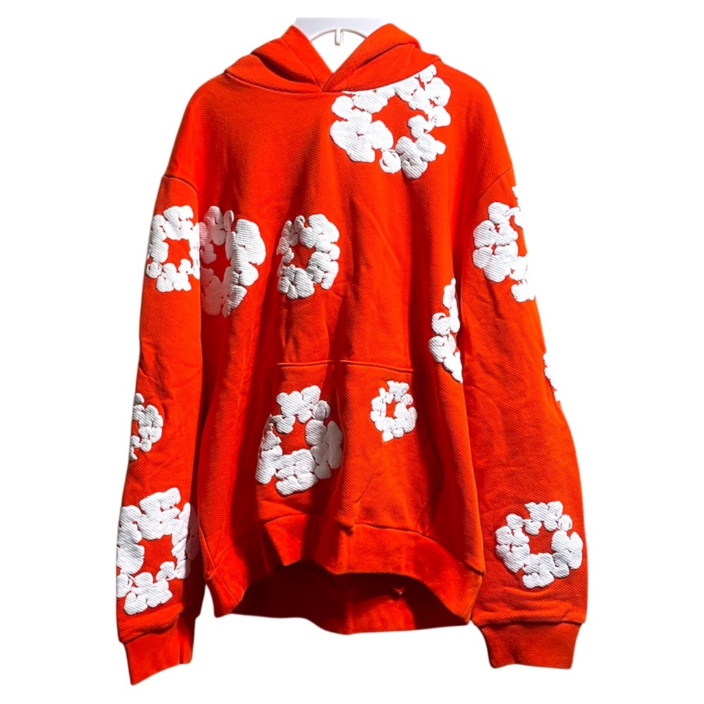 Vibrant Orange Hoodie with White Floral Design